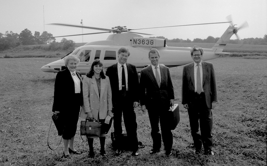 During his extensive career with GE, Denis Nayden '76, '77 MBA (second from right) frequently came to speak on campus, often flying in on the company's helicopter. With Denis are the School's former director of MBA career services, Pat Mochel (far left) and Dick Kochanek, former associate dean and accounting professor (far right). (UConn School of Business)