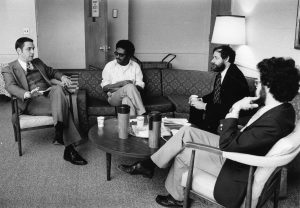 Dean Ronald Patten (left) talks with professors including Mo Hussein (2nd from left) in November 1978.